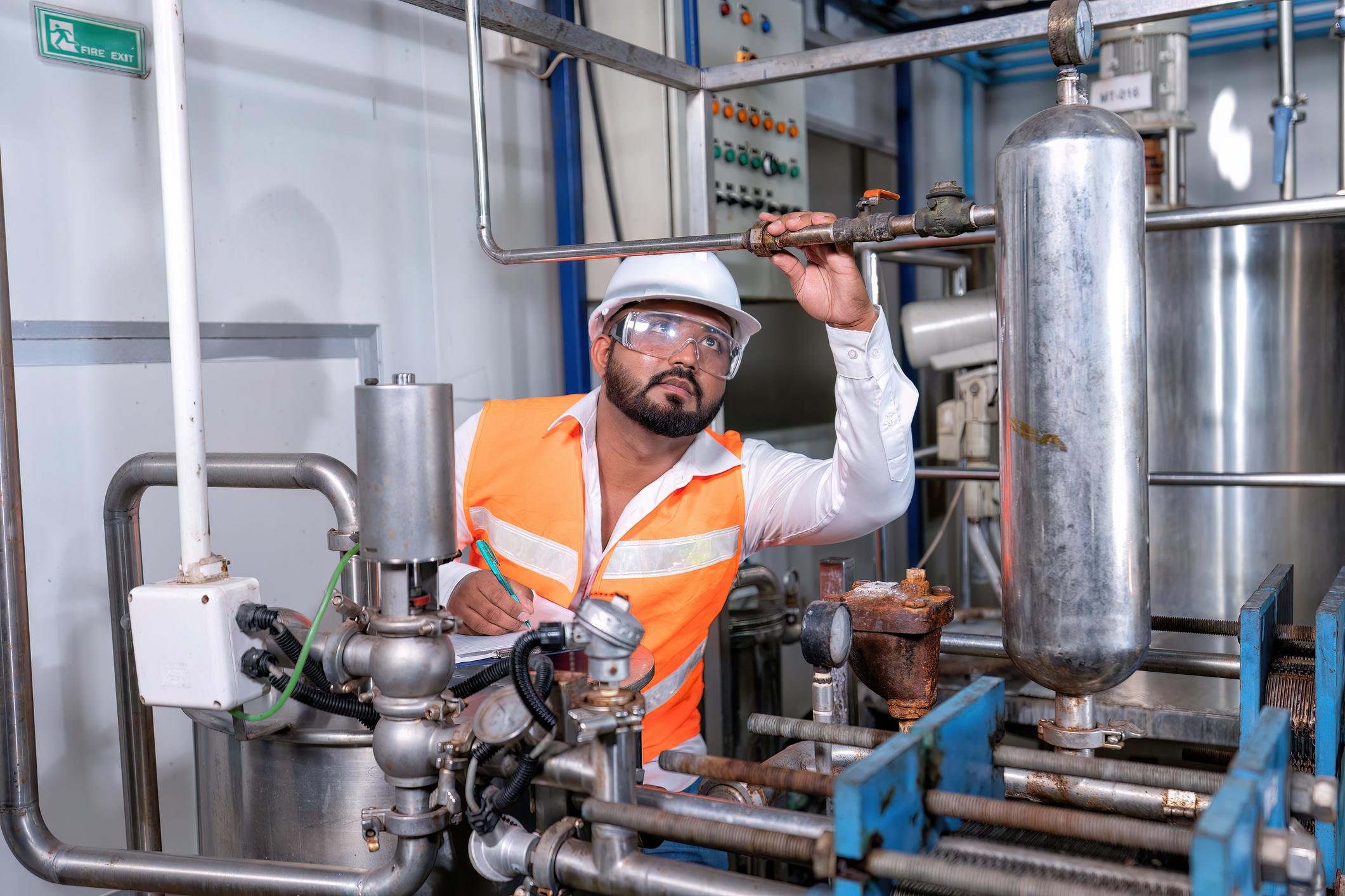 Mechanical engineer inspection pipe tube connection commissioning ready for plant startup machine